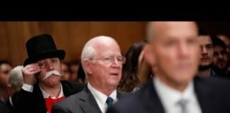 Someone dressed like the Monopoly man photobombed the Senate’s Equifax hearing